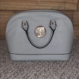 Not sure what brand but taupe pocketbook!
